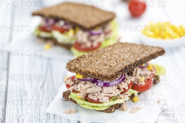 Tuna Sandwich (wholemeal bread, selective focus) on an old wooden table