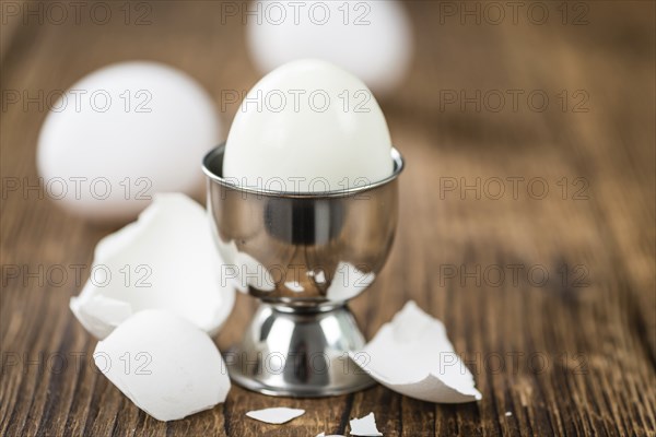 Wooden table with boiled Eggs (selective focus, close-up shot)