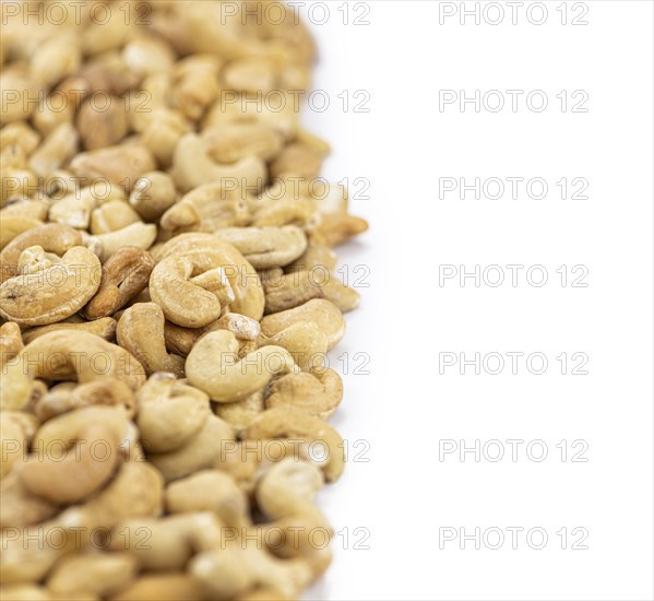 Cashew Nuts isolated on white background (close up shot, selective focus)