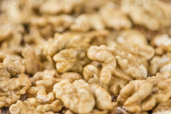 Walnut kernels on a vintage background as detailed close-up shot (selective focus)
