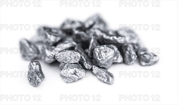Heap of silver nuggets isolated on white background (close up)
