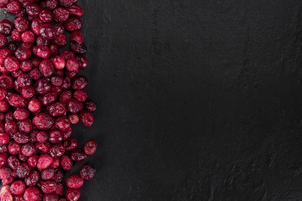 Portion of healthy Dried Cranberries (selective focus, close-up shot)