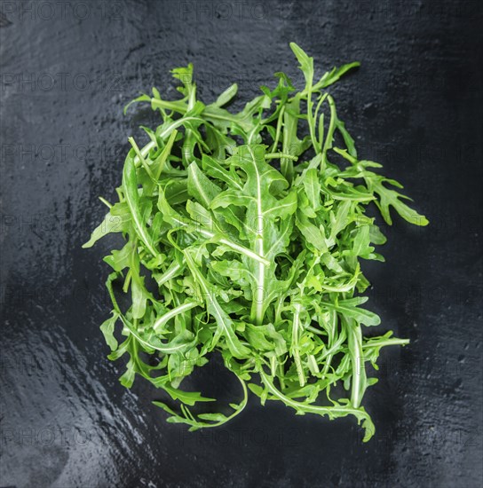 Portion of fresh Arugula (detailed close-up shot, selective focus)