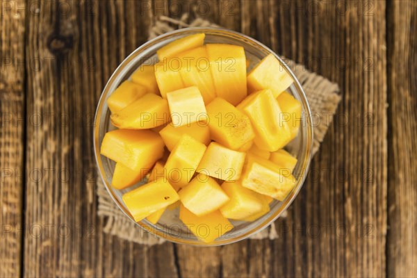 Portion of fresh made Kaki fruits (close-up shot, selective focus)