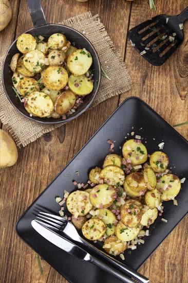 Portion of fresh made Fried Potatoes (selective focus, close-up)