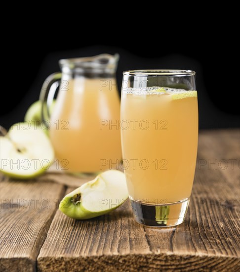 Fresh made Juice (apple) on a vintage background (close-up shot)
