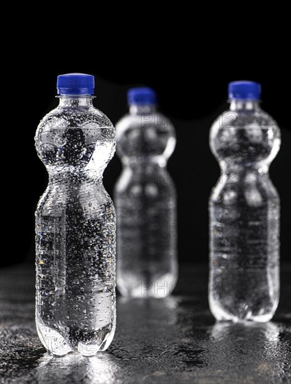 Bottles of chilled sparkling water as detailed close up shot