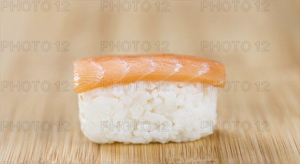 Some fresh made Sushi on a wooden table (selective focus, close-up shot)