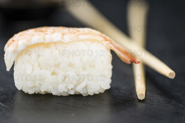 Portion of fresh made Sushi (detailed close-up shot, selective focus)