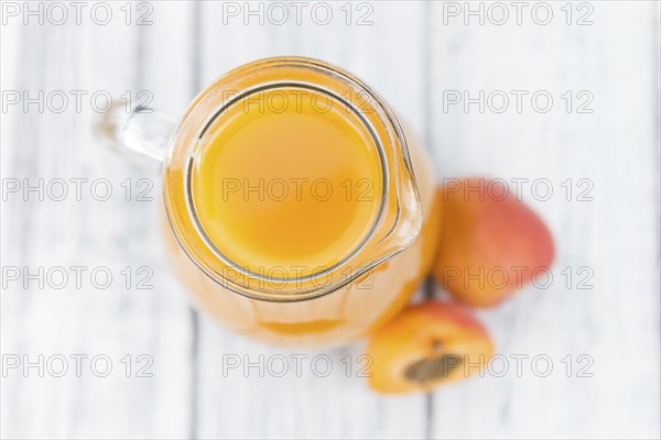 Some homemade Apricot Juice (selective focus) as detailed close-up shot