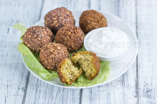 Falafel (close-up shot, selective focus) on an old wooden table