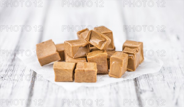 Portion of fresh Caramel (close-up shot, selective focus)
