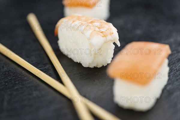 Slate slab with some Sushi (selective focus, close-up shot)