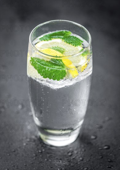 Some Lemonade (with Balm) on a slate slab (close-up shot, selective focus)