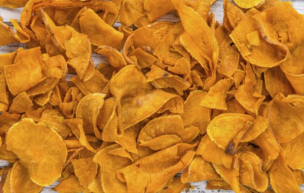 Sweet Potato Chips on a vintage background as detailed close-up shot, selective focus