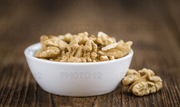 Portion of fresh Walnut kernels (close-up shot, selective focus)