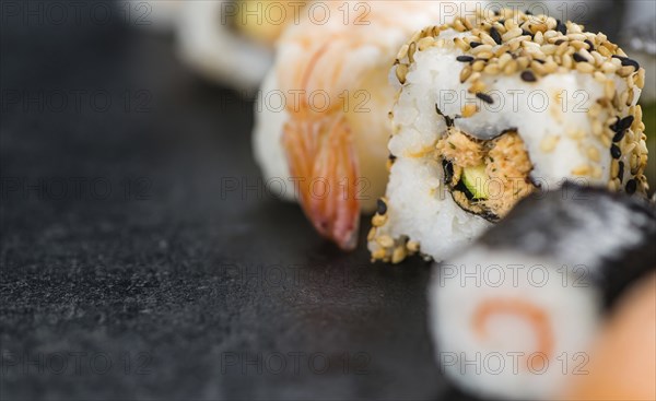 Fresh made Sushi (selective focus) on a vintage looking slate slab