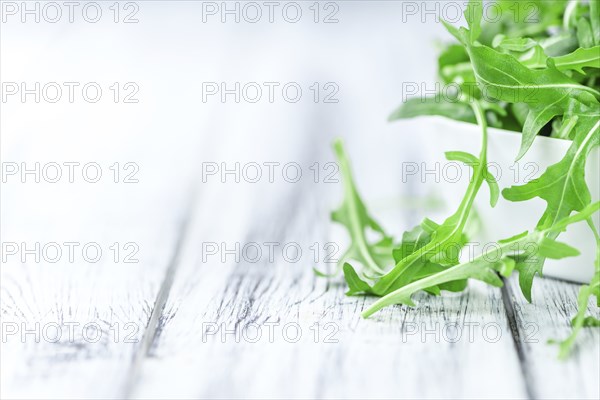 Portion of fresh Arugula (detailed close-up shot, selective focus)
