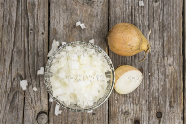 Diced white onions on a vintage background as detailed close-up shot, selective focus