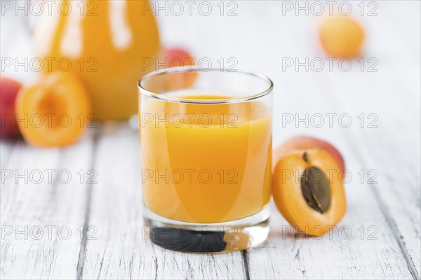 Some homemade Apricot Juice (selective focus) as detailed close-up shot