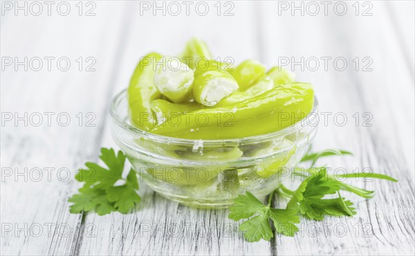 Some homemade Green Chilis (filled with cheese) (selective focus) as detailed close-up shot