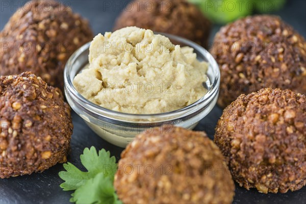 Homemade Falafel (close-up shot, selective focus) on wooden background