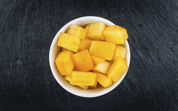 Portion of fresh made Kaki fruits (close-up shot, selective focus)