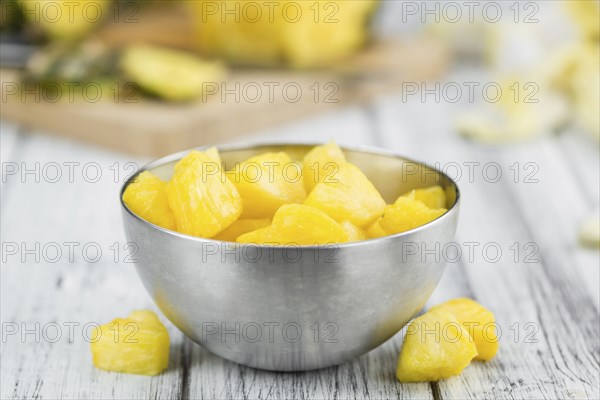 Fresh made Pineapple (sliced) on a vintage background as detailed close-up shot
