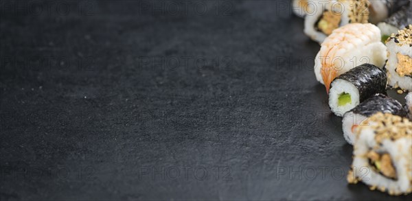 Portion of fresh made Sushi (detailed close-up shot, selective focus)