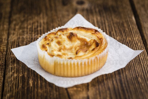 Fresh made Mini Cheesecake on a vintage background (close-up shot)