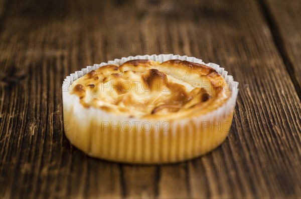 Homemade Cheesecake on an wooden table (selective focus) as detailed close-up shot