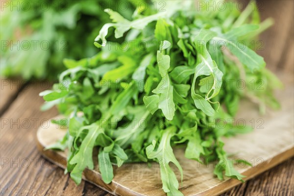 Portion of fresh Arugula (detailed close-up shot, selective focus)