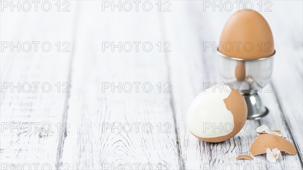 Wooden table with boiled Eggs (selective focus, close-up shot)