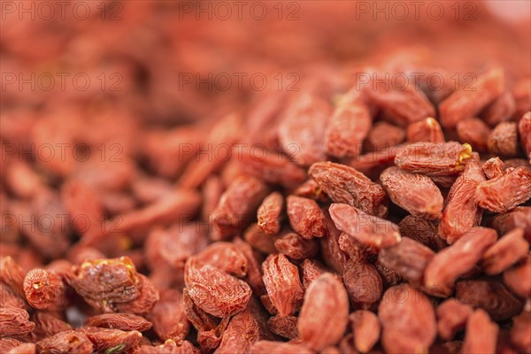 Goji Berries on a vintage background as detailed close-up shot (selective focus)