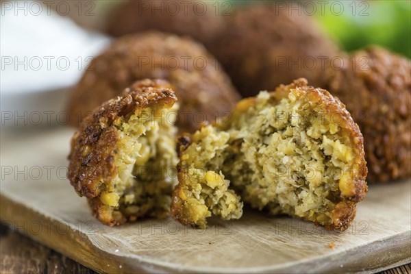 Falafel (close-up shot, selective focus) on an old wooden table