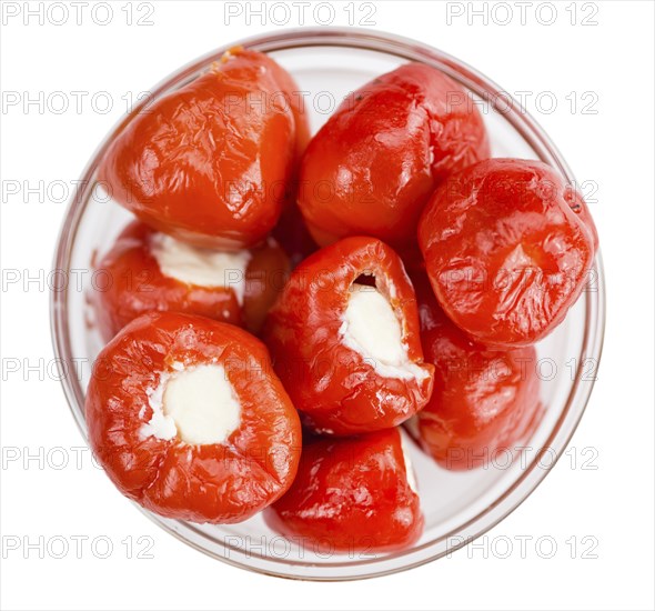 Fresh made Red Pepper (stuffed with cheese) isolated on white background (close-up shot)