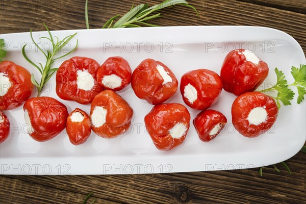 Homemade Filled Pimientos on vintage background (selective focus, close-up shot)