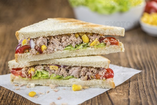 Tuna Sandwich (selective focus, close-up shot) on vintage background