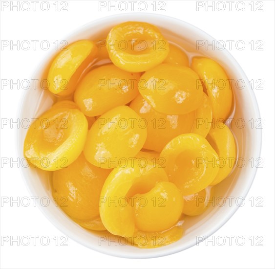 Portion of Pickled Apricots (as close-up shot) isolated on white background