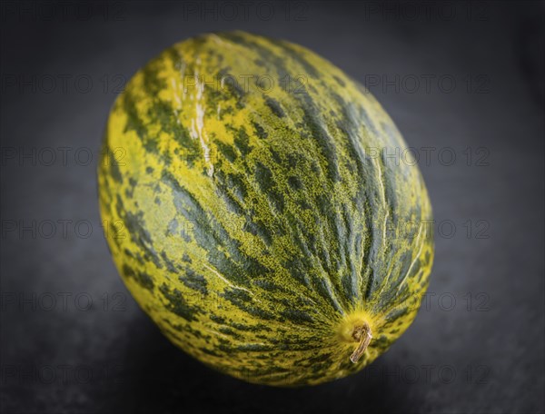 Futuro Melons on a vintage slate slab (close-up shot, selective focus)