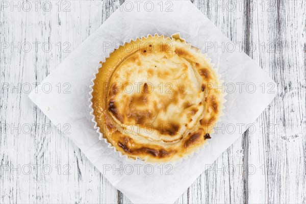 Homemade Cheesecake on an wooden table (selective focus) as detailed close-up shot
