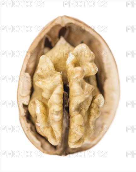 Portion of Walnut kernels (as close-up shot) isolated on white background
