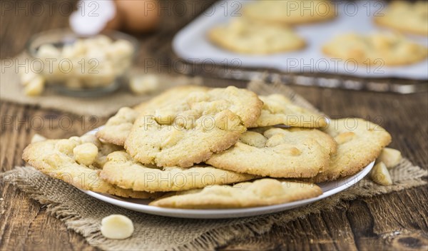 Vintage wooden table with Cookies (selective focus, close-up shot)