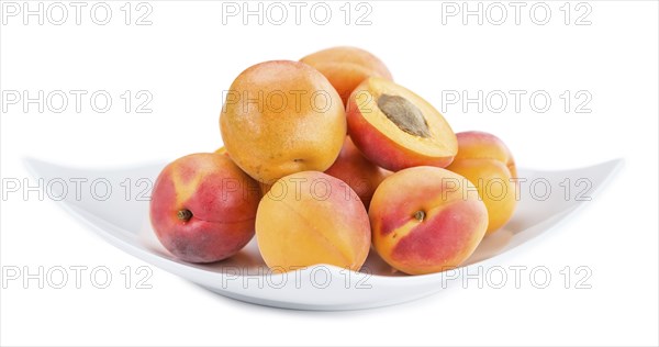 Portion of Apricots (as close-up shot) isolated on white background