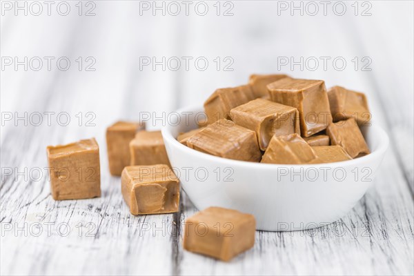 Portion of fresh Caramel (close-up shot, selective focus)