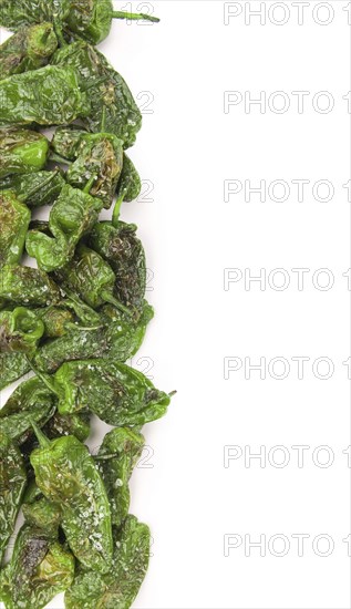 Pimientos de Padron isolated on white background, selective focus, close-up shot