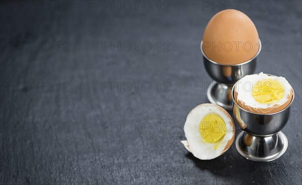 Slate slab with boiled Eggs (selective focus, close-up shot)