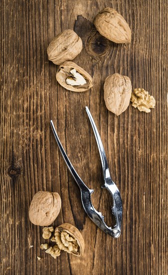 Walnuts on a vintage background as detailed close-up shot (selective focus)