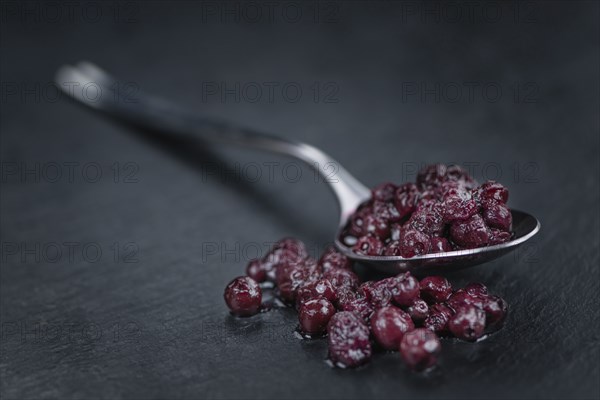Canned Blueberries on a vintage slate slab as detailed close-up shot, selective focus