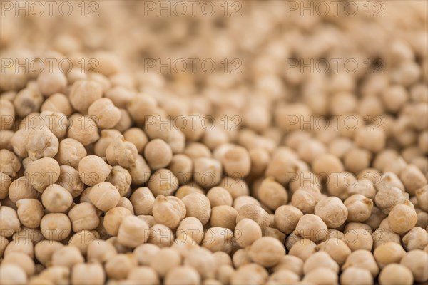 Chickpeas on a vintage background as detailed close-up shot, selective focus
